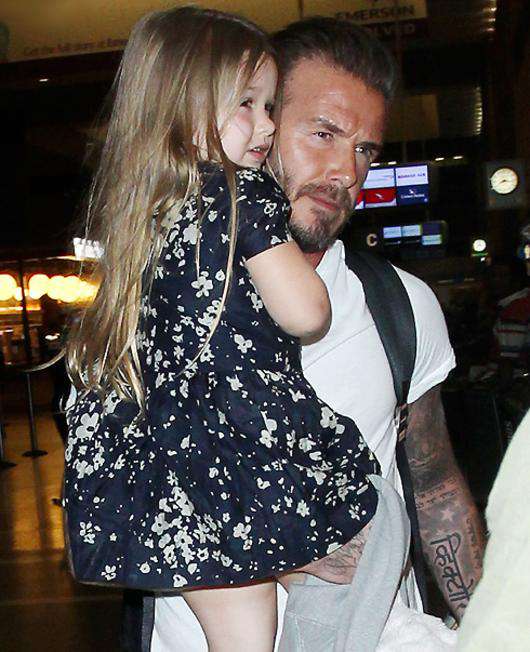 Дэвид Бекхэм с дочерью Харпер. Фото: Rex Features/Fotodom.ru.