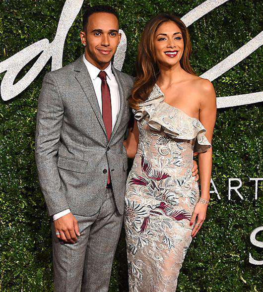 Льюис Хэмильтон и Николь Шерзингер. Фото: AP Images.