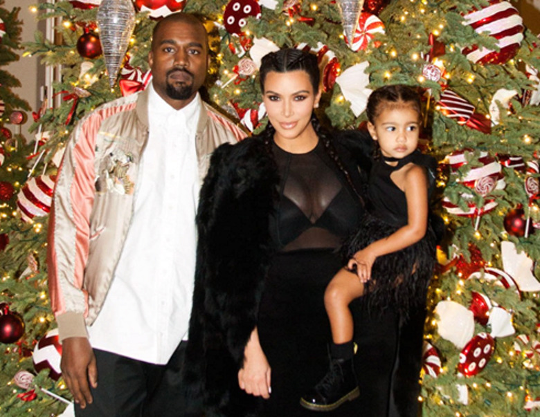 Ким Кардашьян с мужем Канье Уэстом и дочерью Норт